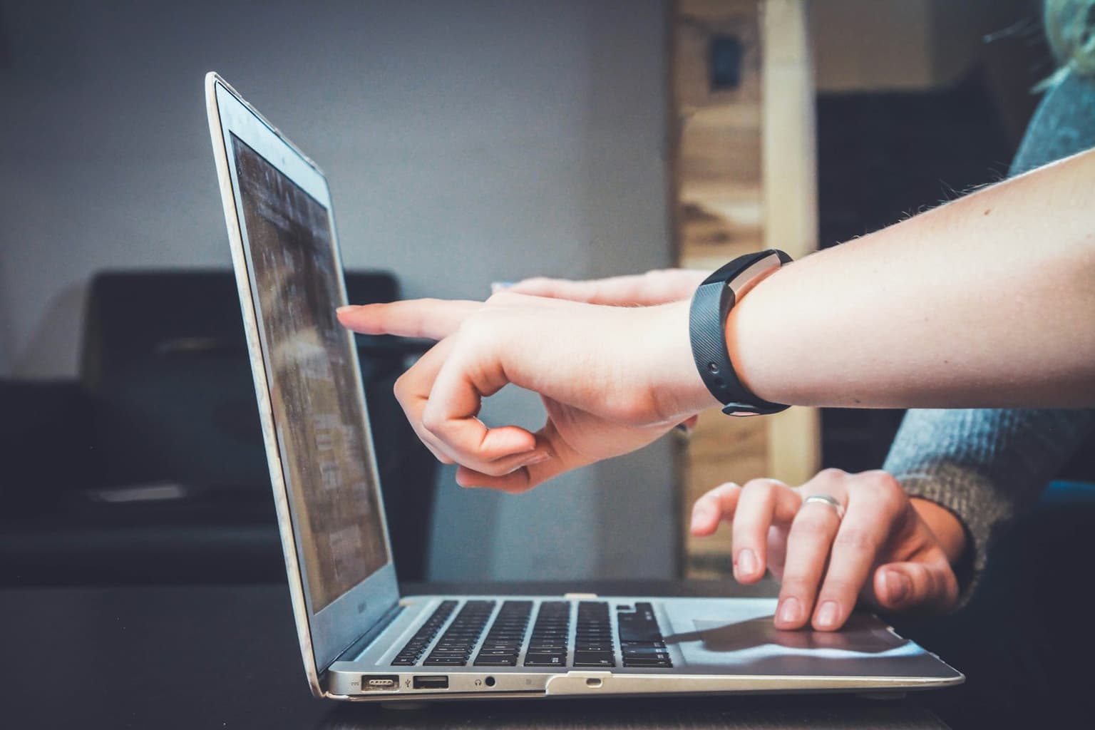 Customer reviewing an enrollment form on a laptop